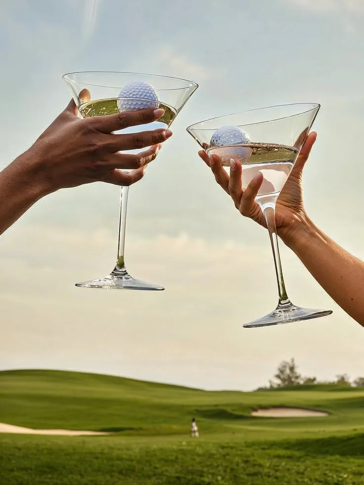 Two cocktails with golf balls on a course, representing Loft Golfing packages and premium hosting.