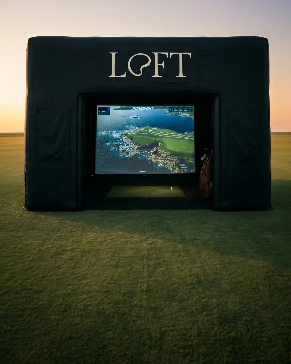 A Loft Golfing simulator tent set up on a fairway, representing Loft Golfing packages and premium hosting.